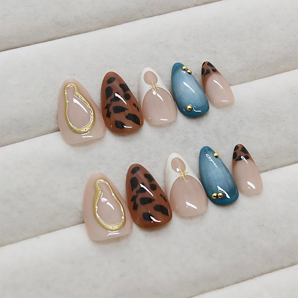 Model wearing medium almond shaped leopard French tip press on nails
