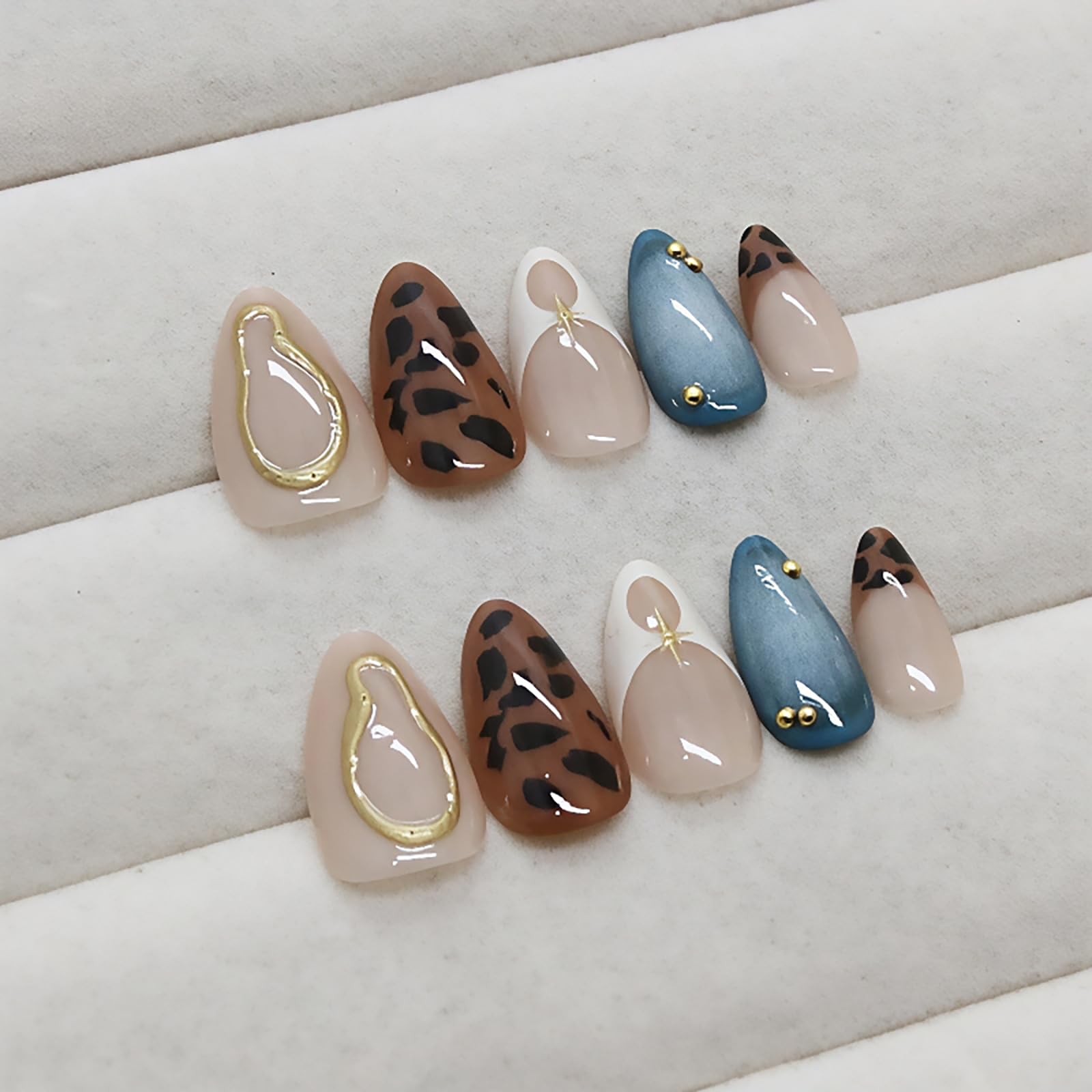 Model wearing medium almond shaped leopard French tip press on nails