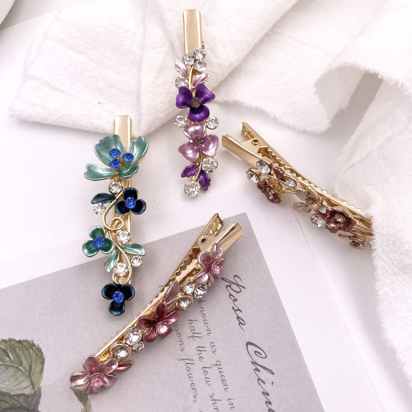 Lizzie Kay vintage flower decorative hair accessories displayed on a flat surface showing intricate petal veins