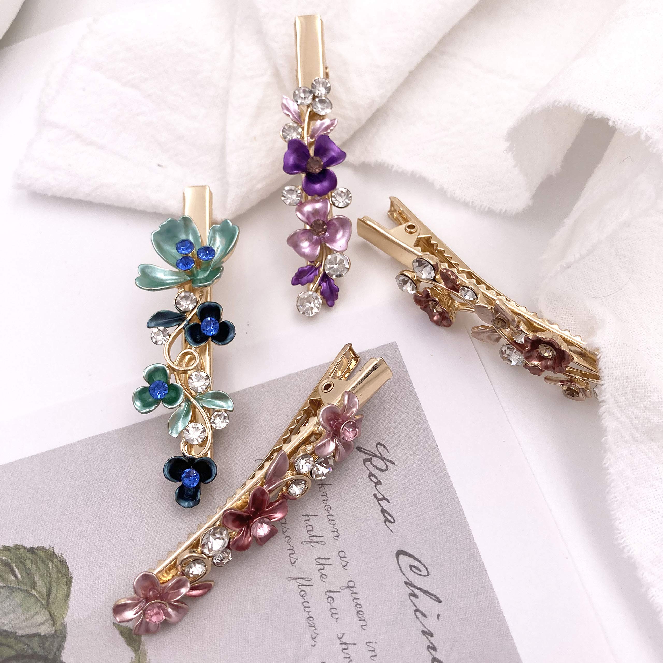 Lizzie Kay vintage flower decorative hair accessories displayed on a flat surface showing intricate petal veins