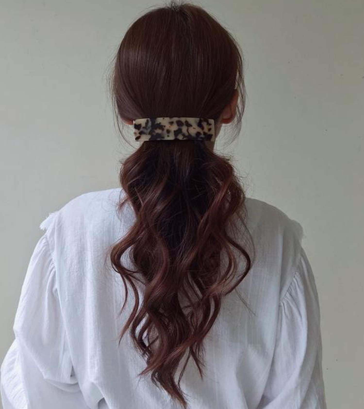 Eyegla rectangle celluloid acetate hair clips in Tokyo and Ivory Tokyo patterns displayed side by side