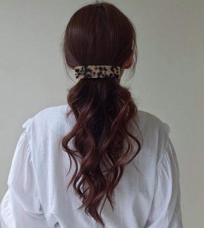 Eyegla rectangle celluloid acetate hair clips in Tokyo and Ivory Tokyo patterns displayed side by side