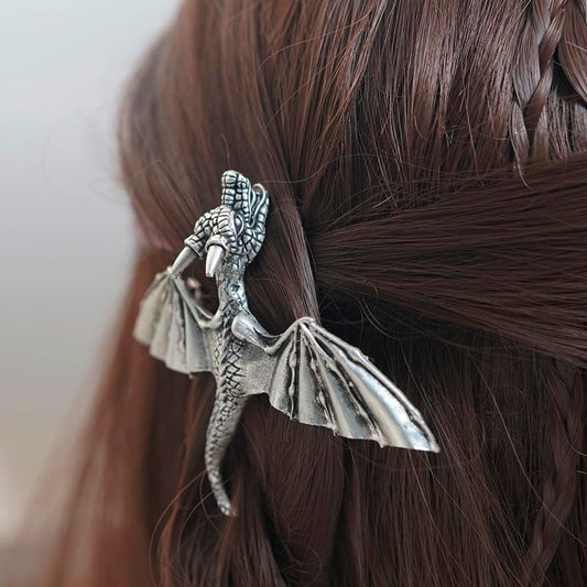 Side angle of the antiqued Viking style dragon barrette highlighting the detailed scale patterns.