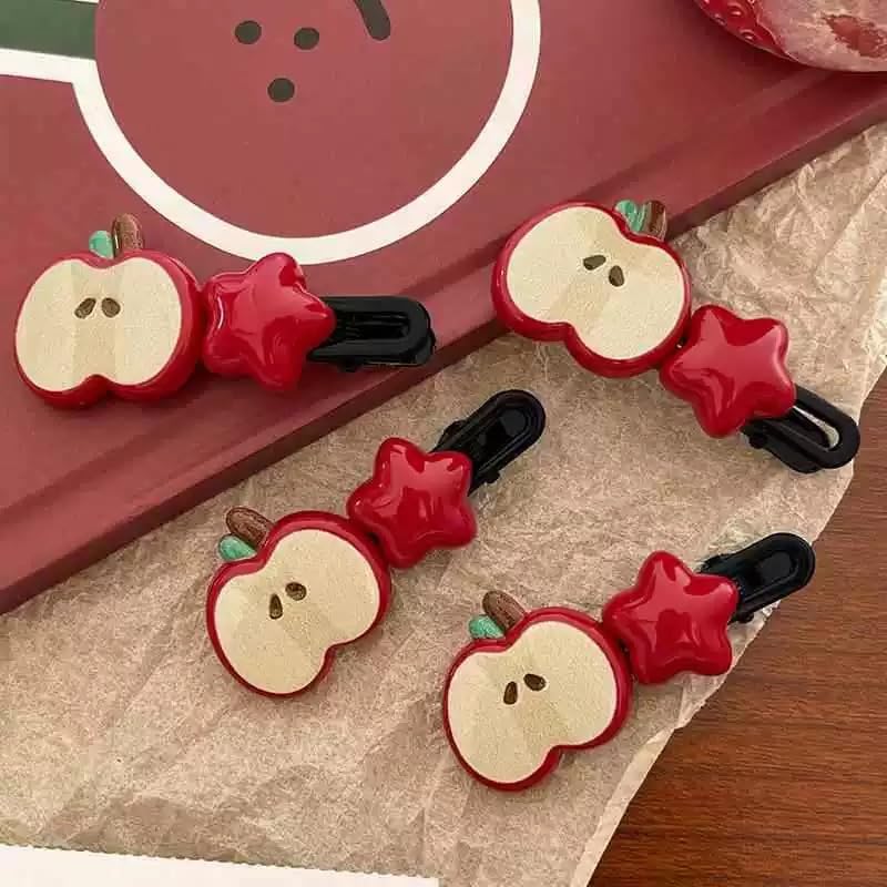 Dhdfisd Y2K aesthetic red apple hairpiece close up texture detail