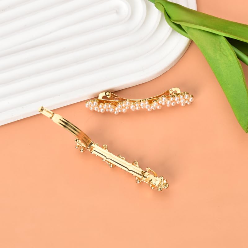 Close up of Kefley gold barrette clips showing the intricate handmade pearl bead clusters and shiny metallic finish