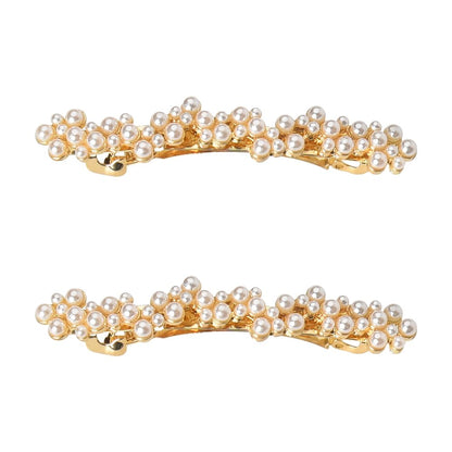 Kefley brand vintage gold and pearl hair pins showing the glittering rhinestones embedded along the metallic frame
