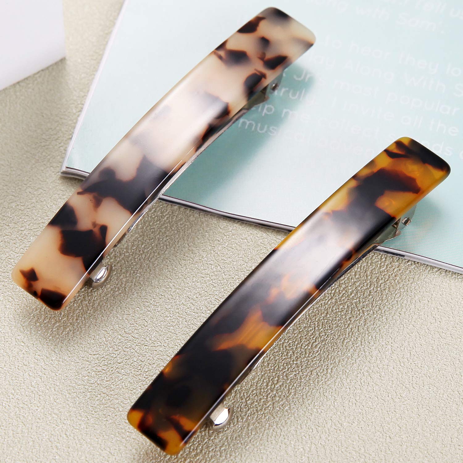 Back view of the Eyegla tortoise shell hair barrette demonstrating the sturdy metal automatic spring closure mechanism.