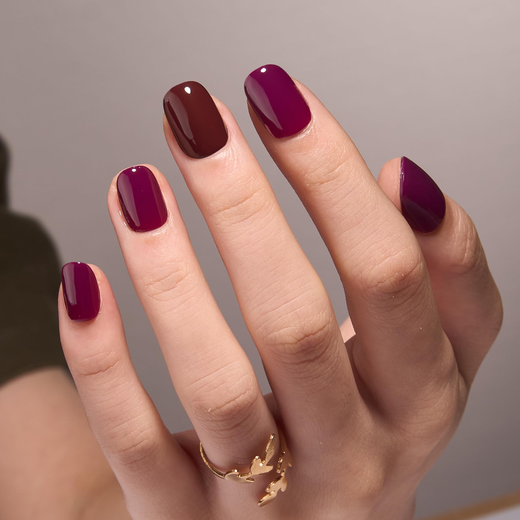 Hand wearing Curvlife short glossy press on nails