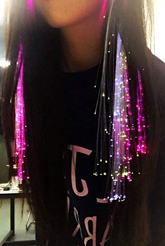Close up view of the glowing color changing fiber optic strands attached to a braid extension