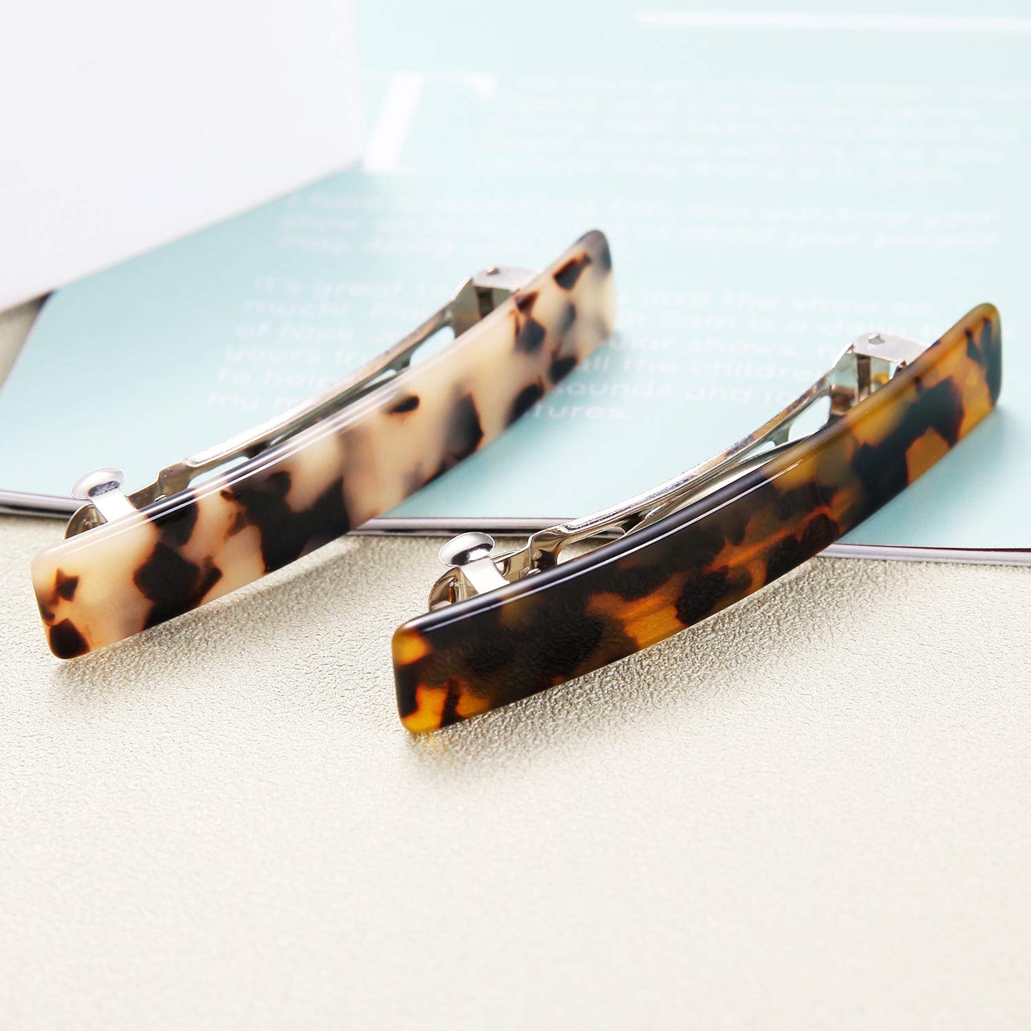 Premium Eyegla celluloid rectangle hair clips neatly arranged inside their elegant presentation gift box package.