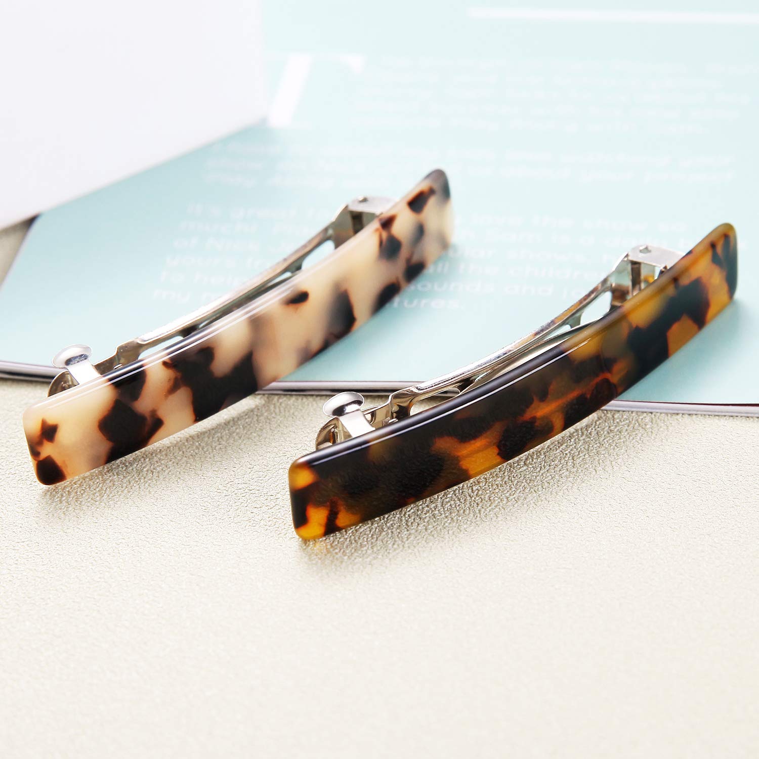 Premium Eyegla celluloid rectangle hair clips neatly arranged inside their elegant presentation gift box package.