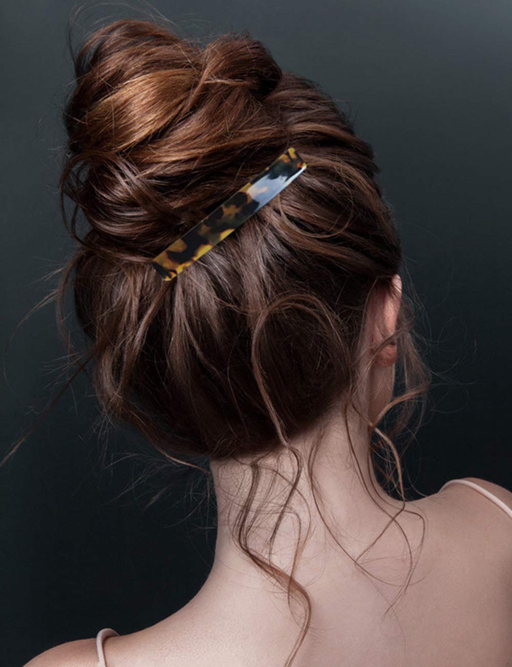 The complete two piece Eyegla luxury hair accessory set displayed together to show the contrast between the dark and light tortoise shell designs.