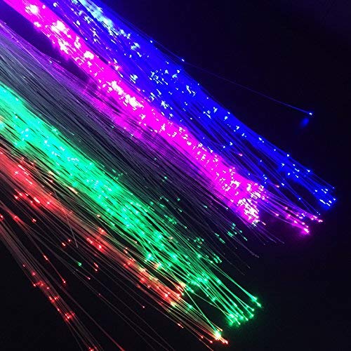 Demonstration of trimming the durable fiber optic hair extensions with scissors for custom fit