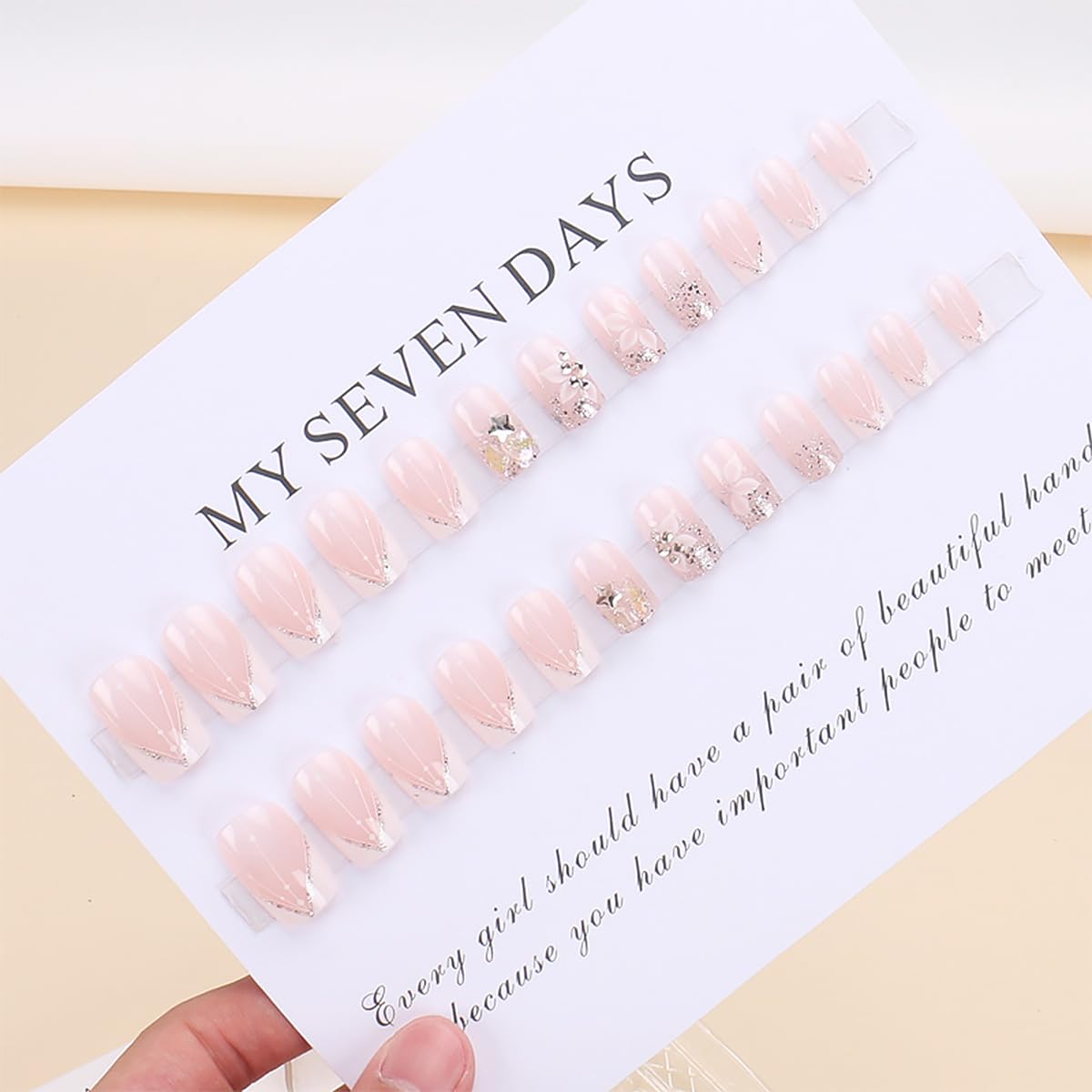 Angle view showing glossy finish of Kinretixia short square artificial nails