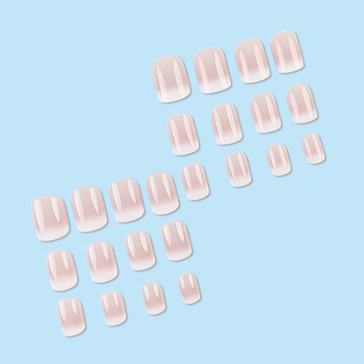 Close up of Juggssa French ombre glossy fake nails
