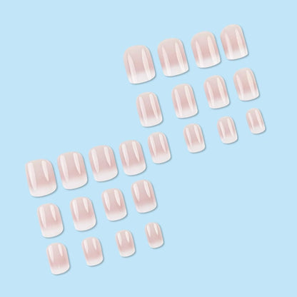 Close up of Juggssa French ombre glossy fake nails