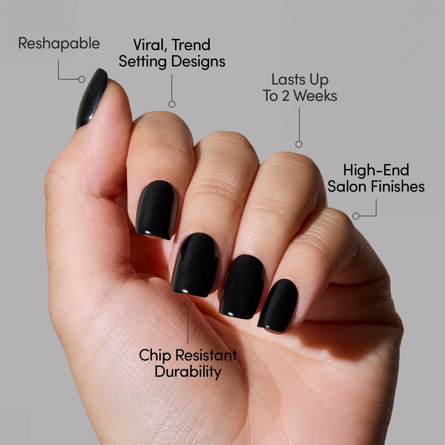 Hand wearing Glamnetic short squoval jet black press on nails