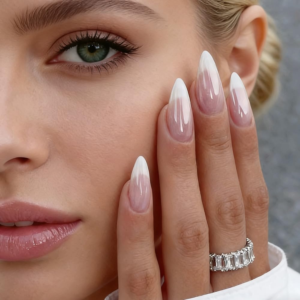 Close up of almond shaped press on nails with french tip