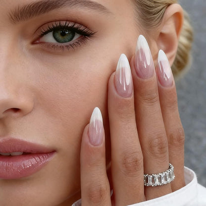Close up of almond shaped press on nails with french tip