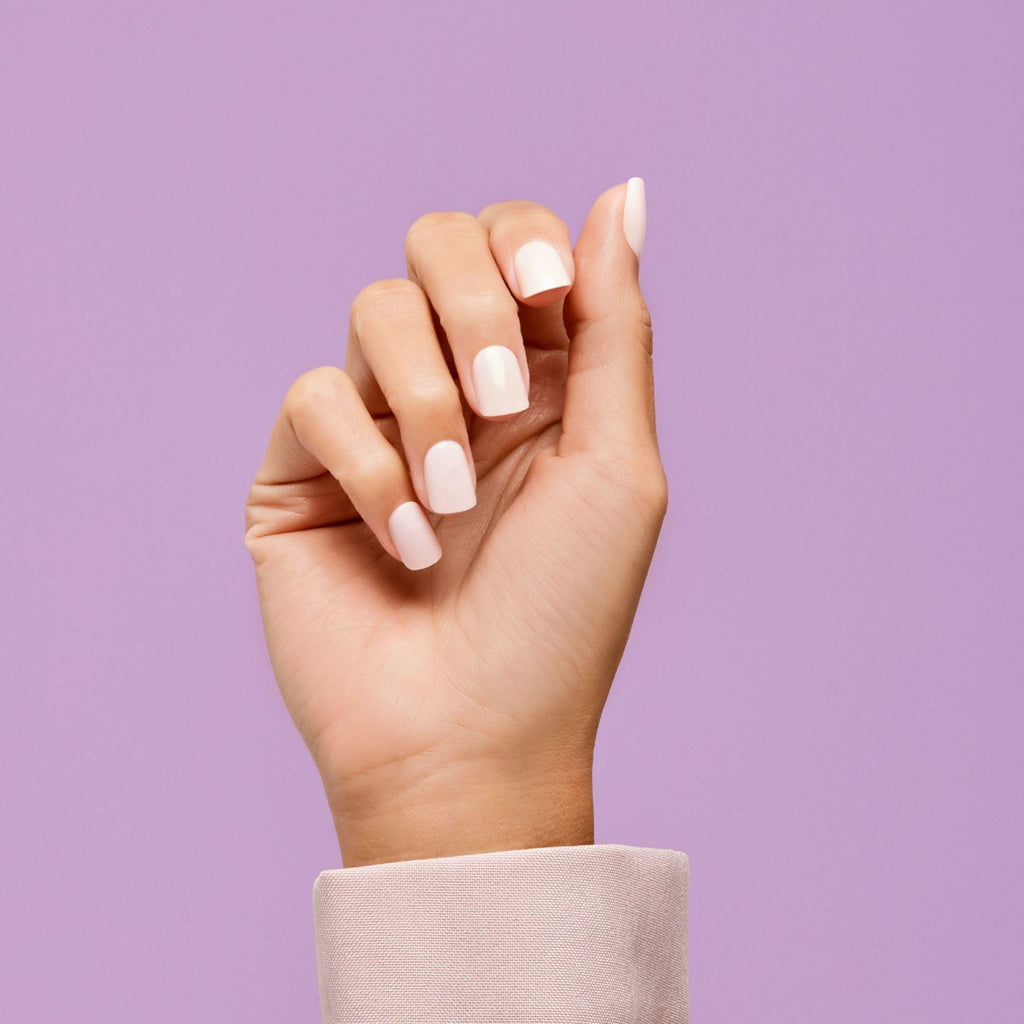 Close-up of Point Pink glossy solid color fake nails arranged neatly in the box