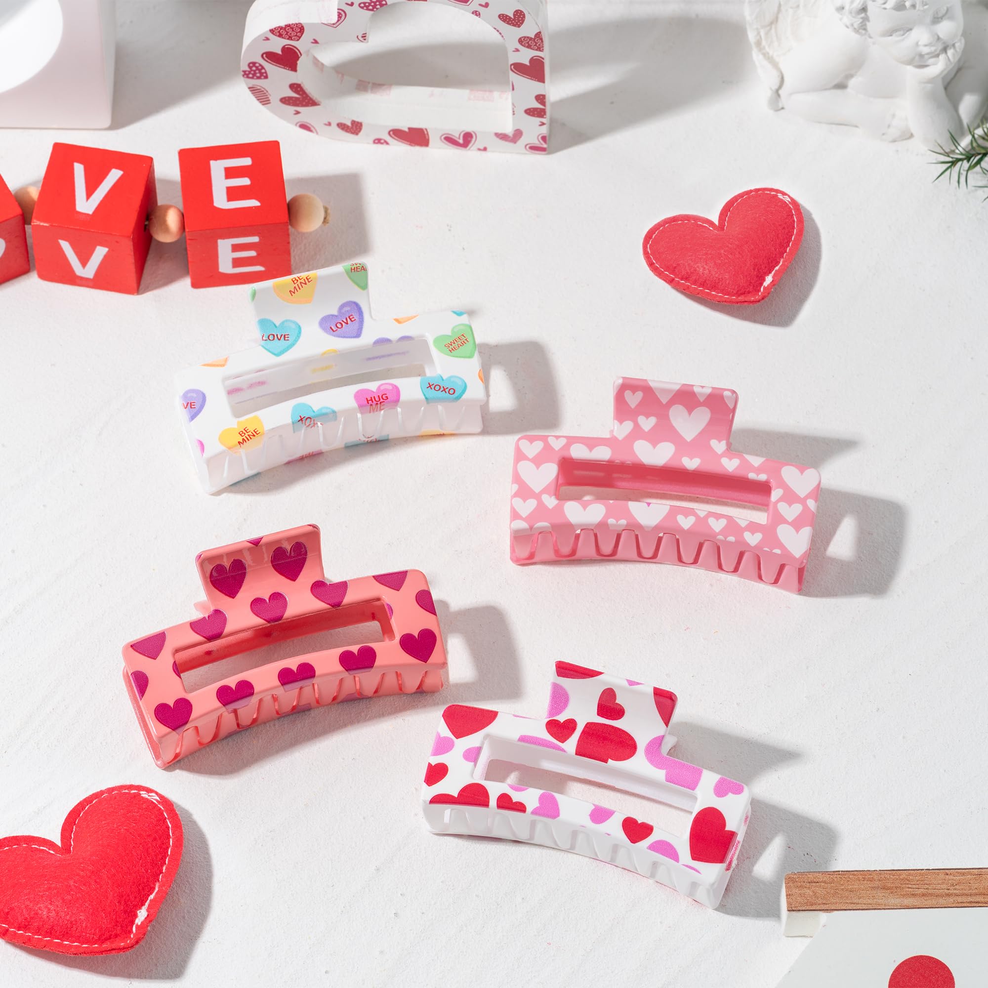 Pantide red heart print claw clips on pink background