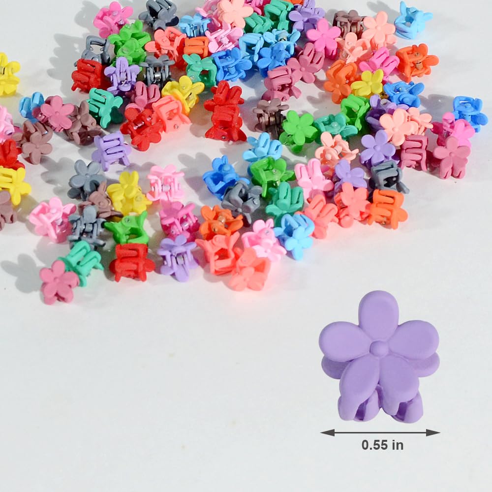 Close up shot of a small tiny rainbow flower hair clamp highlighting the secure grip jaw.