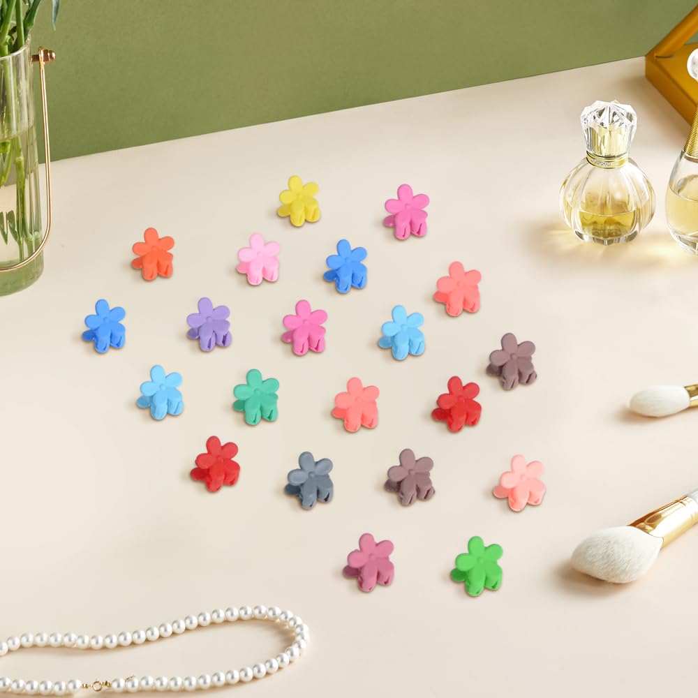 Cute non slip tiny rainbow hair clips arranged by color gradient to show the diverse palette.