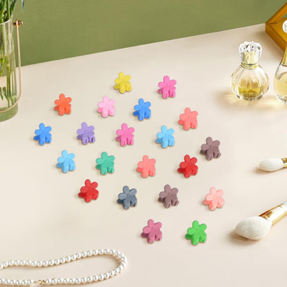 Cute non slip tiny rainbow hair clips arranged by color gradient to show the diverse palette.