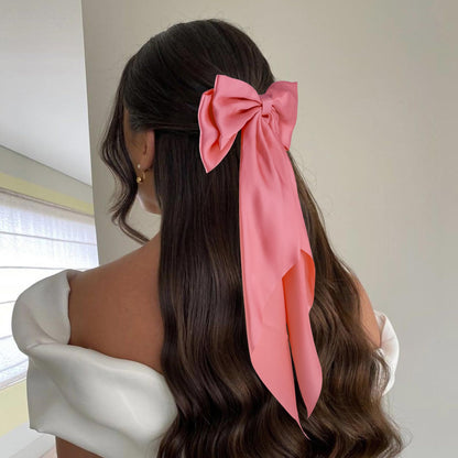 Assorted colors of large ribbon hair bows including black and pink