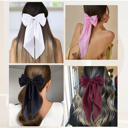 Side view of long tail satin hair bow clip in white