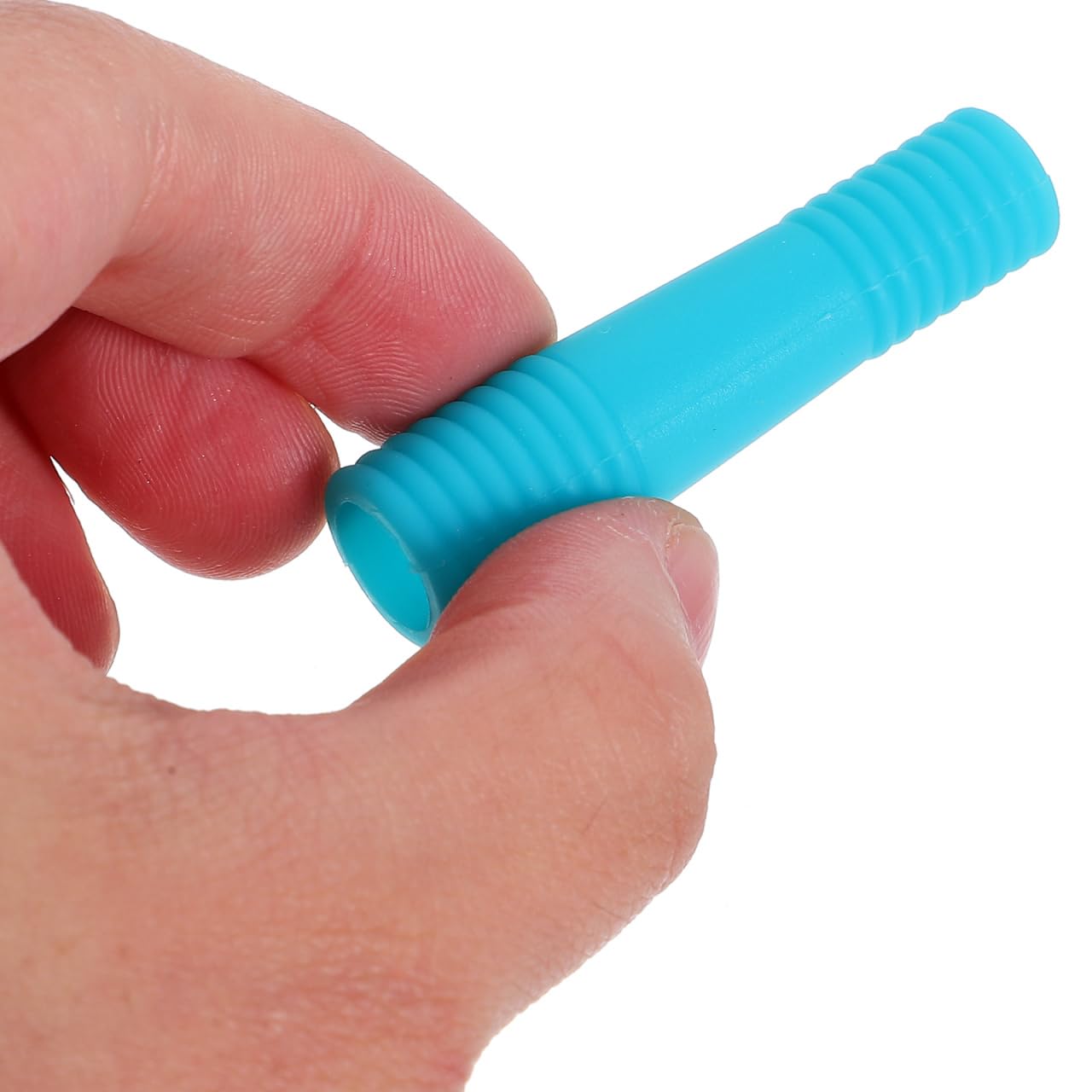Close up view of flexible silicone protective cases being slipped onto a professional cuticle trimmer handle for enhanced grip.