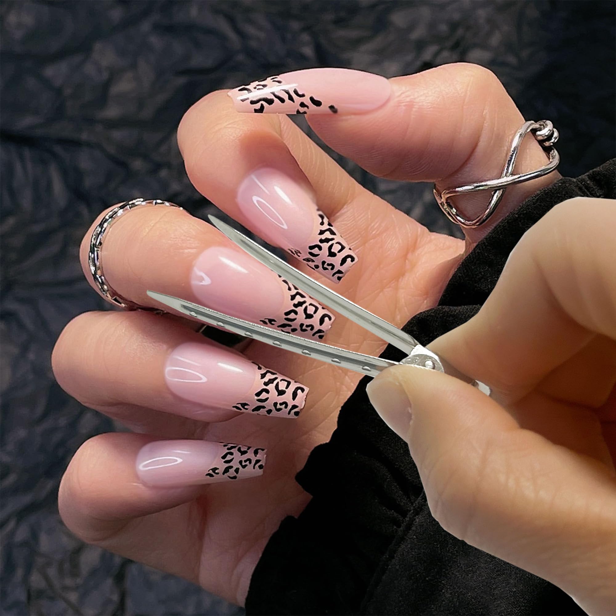 Close up of an individual XLANMAY nail polish protector clip positioned on a finger for mess free manicure art