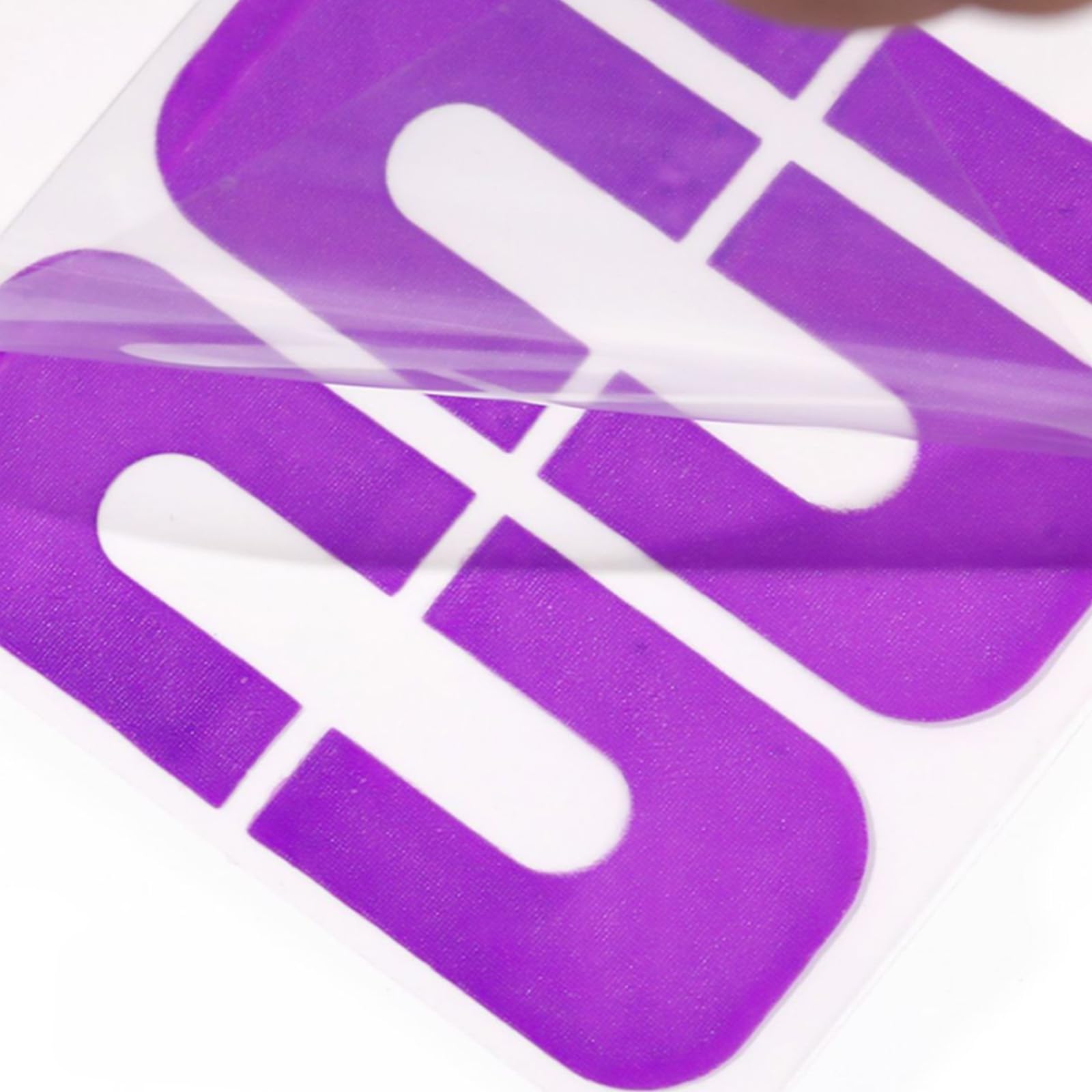 Easy peel-off finger guard stickers being removed from a fingertip to reveal a clean and smudge-free nail line.