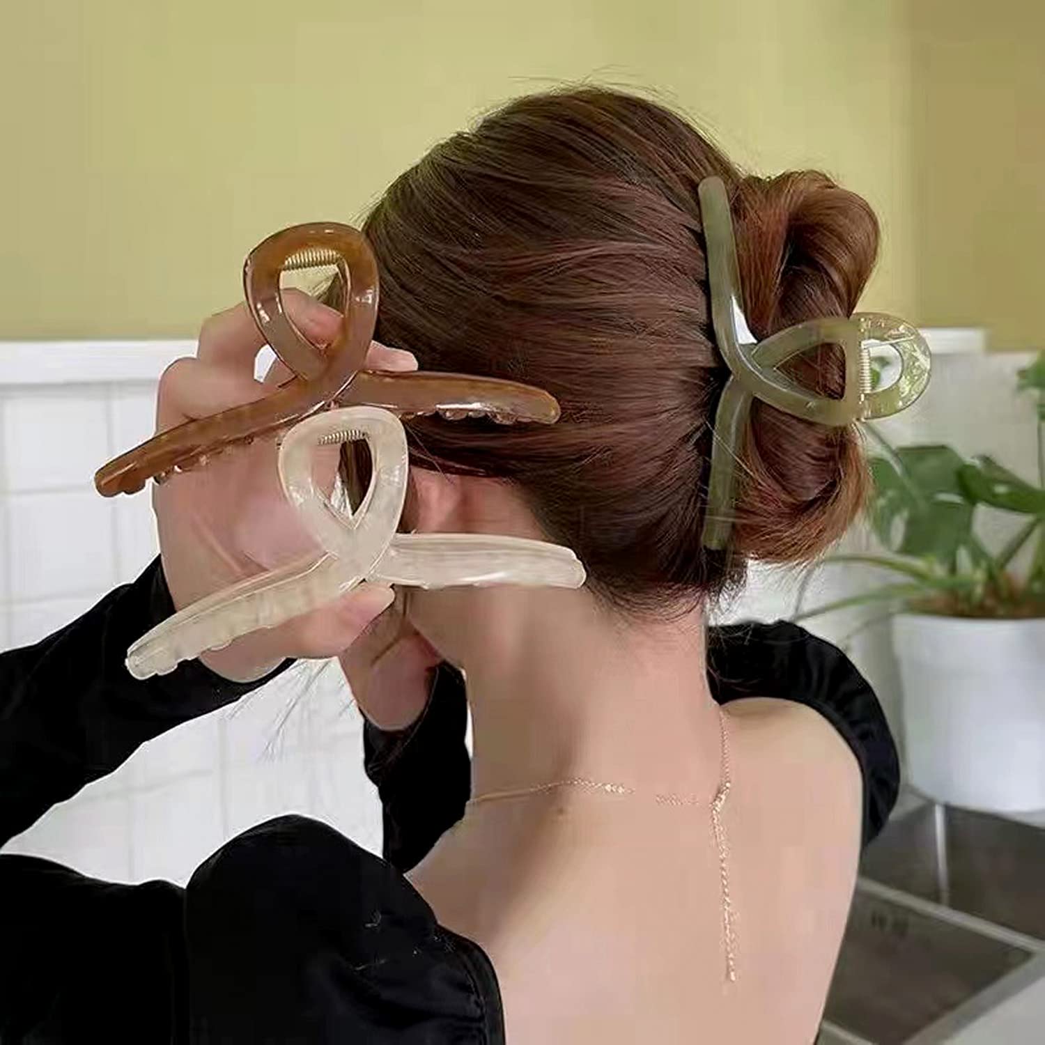 FAELBATY large butterfly hair accessories displaying the strong non slip inner alloy spring mechanism