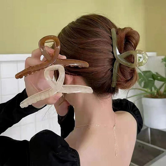 FAELBATY large butterfly hair accessories displaying the strong non slip inner alloy spring mechanism