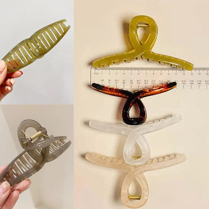 FAELBATY oversized hair claw clips showing the smooth rounded teeth for comfortable scalp wear