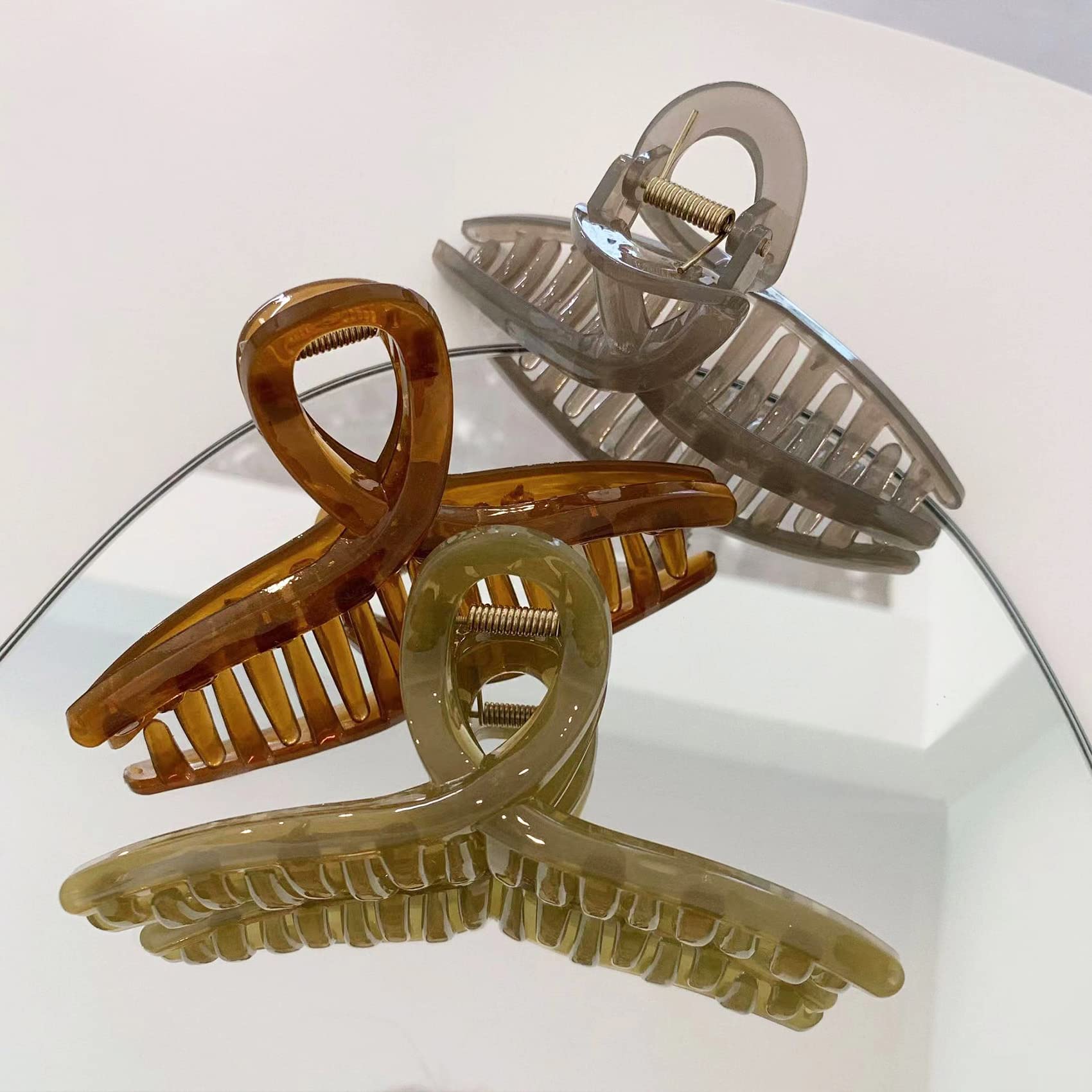 FAELBATY imported butterfly hair clips holding a thick French twist hairstyle in place