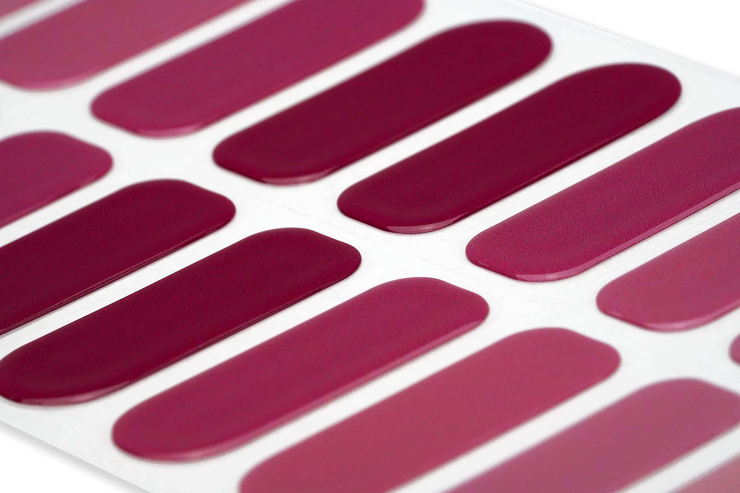 Gradient burgundy gel nail wraps with application file and cuticle stick accessories.