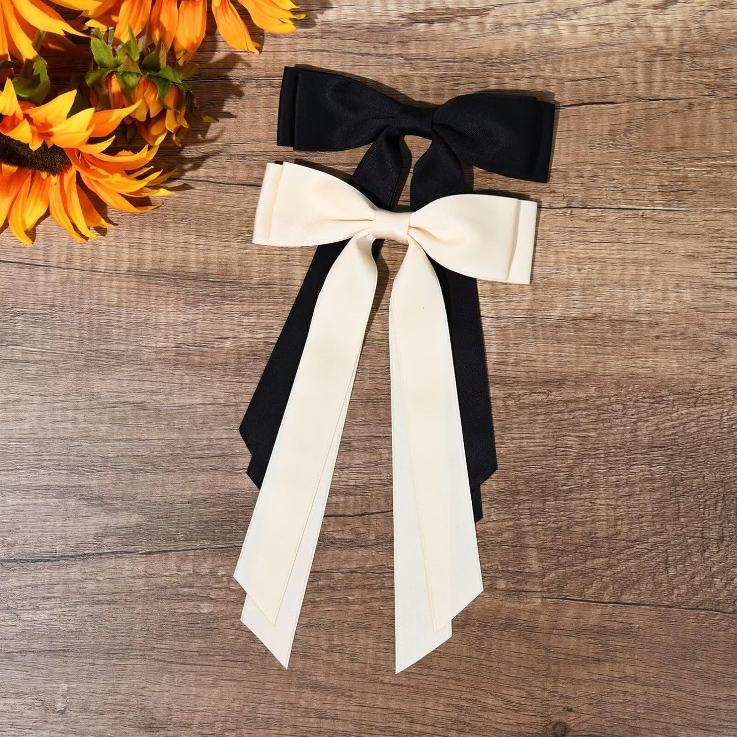 Belicia premium hair bow styling demonstration showcasing the soft touch fabric texture.