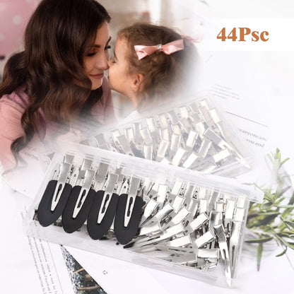 Forty four count assortment of silver and black metal beauty clips