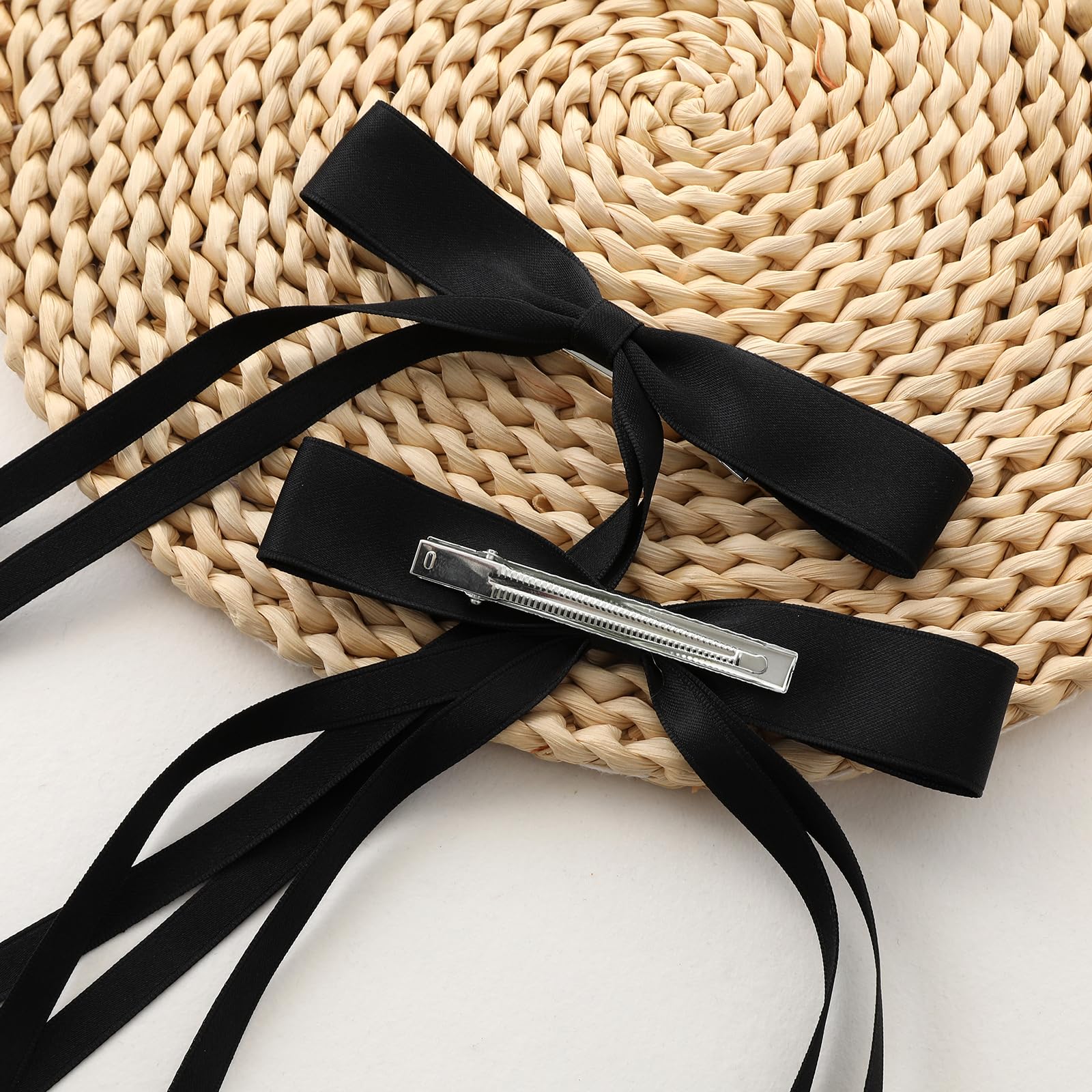 Elegant long tail silk ribbon barrettes displayed in a structured rows layout