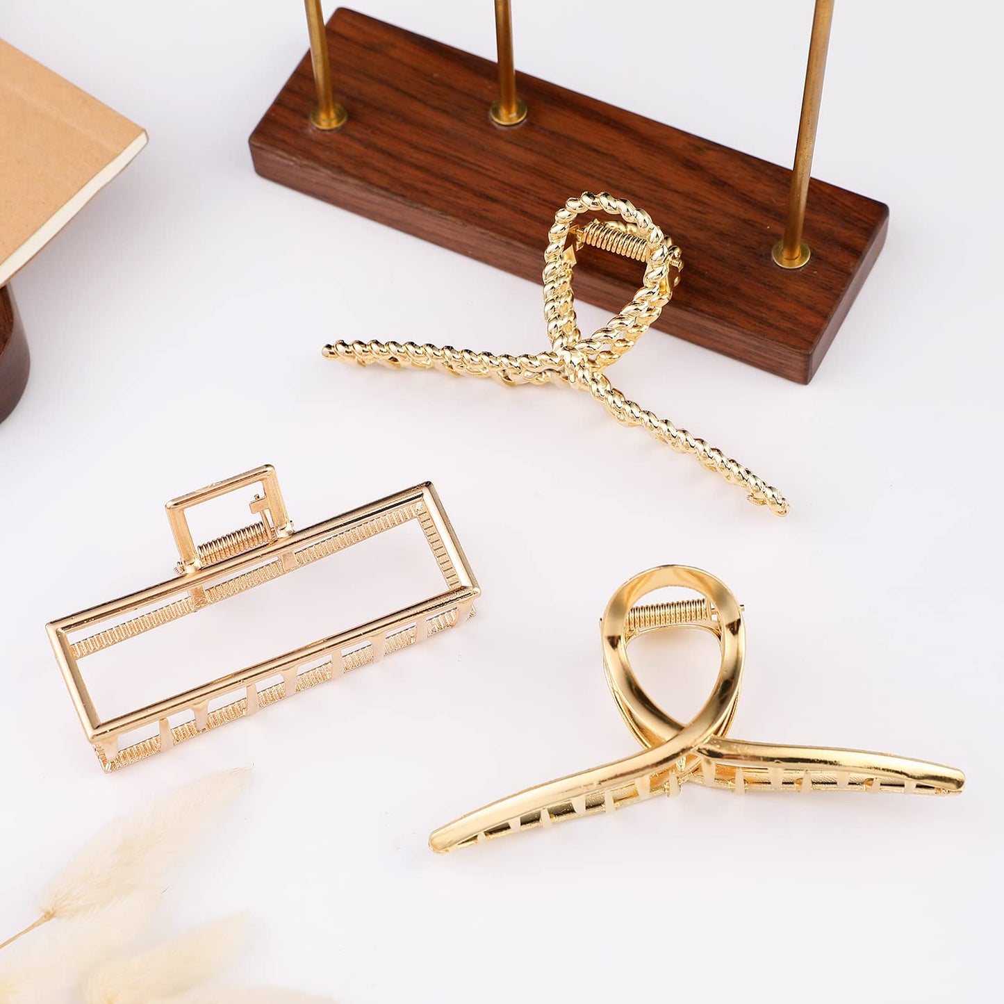 Three pieces of fashion styling jaw clips arranged neatly to show color variations