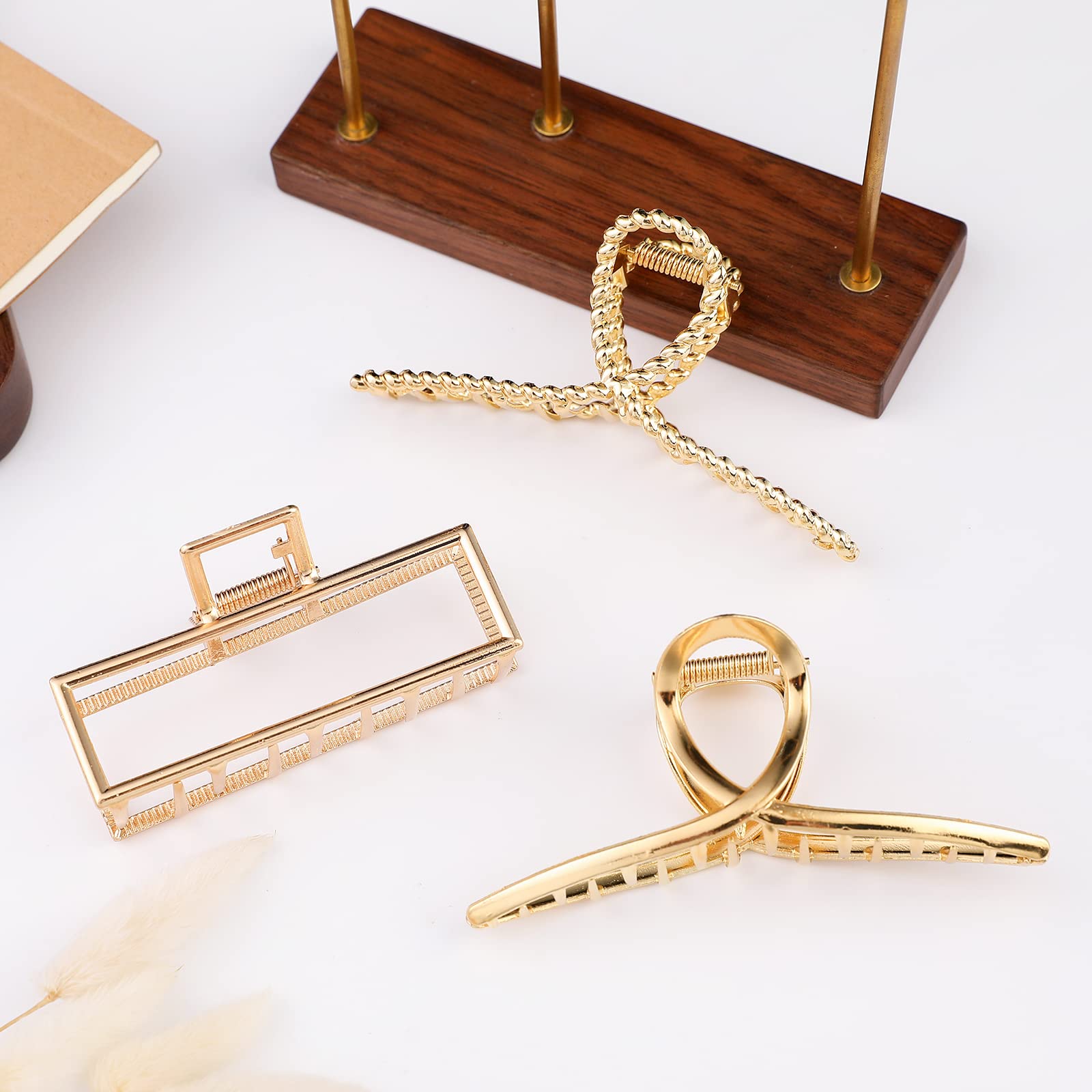 Three pieces of fashion styling jaw clips arranged neatly to show color variations