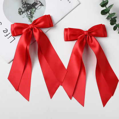 Two LuSeren red hair ribbon clips for ponytail styling