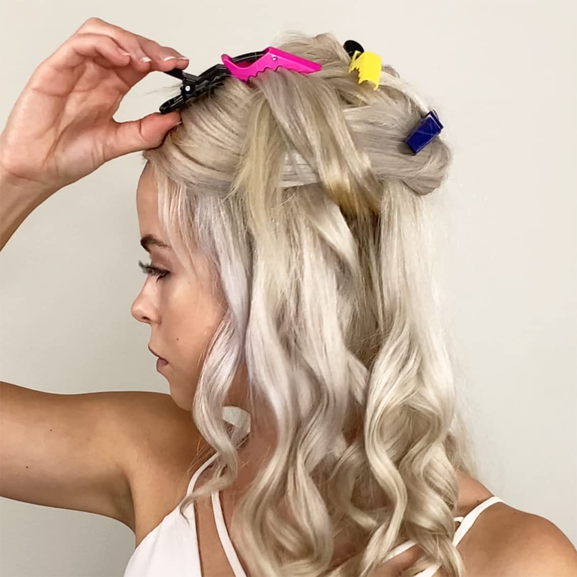 Close-up view of the double-hinged mechanism on the professional hair sectioning clip.