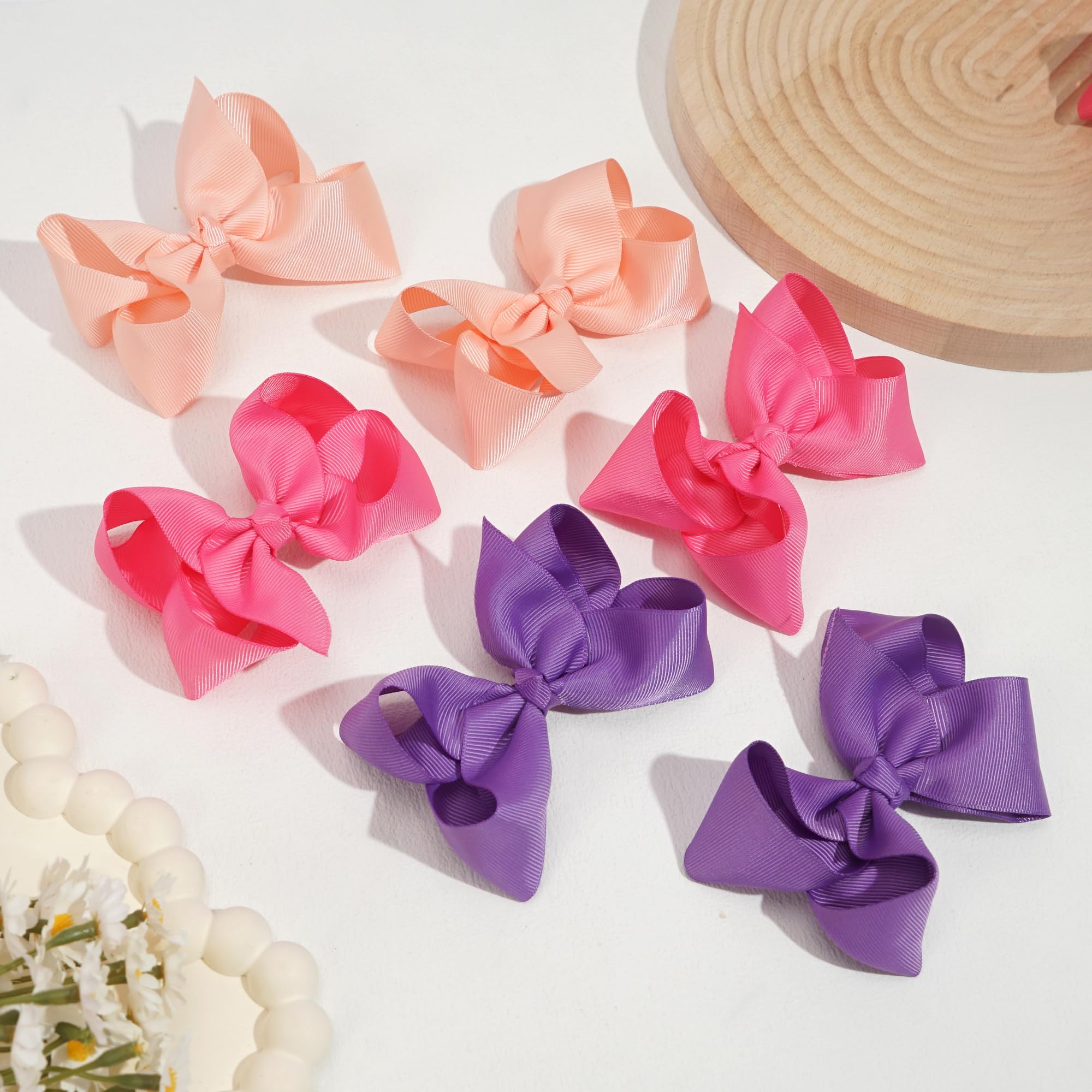 Assorted vibrant color pairs of CÃ©llot boutique hair bows for toddlers