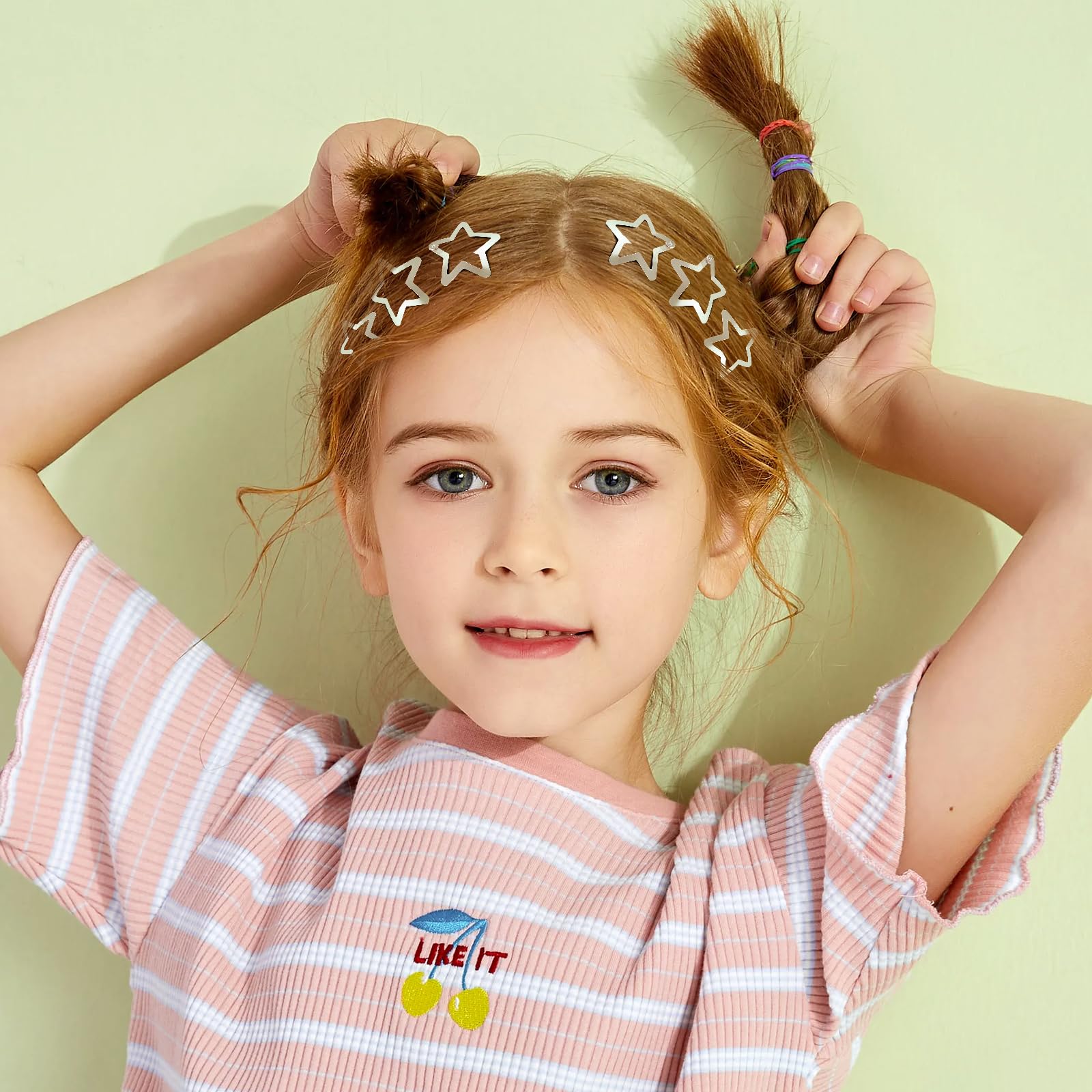 Trendy 2000s aesthetic space buns styled with silver star clips.