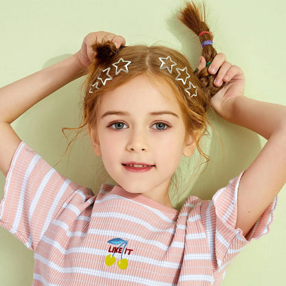 Trendy 2000s aesthetic space buns styled with silver star clips.