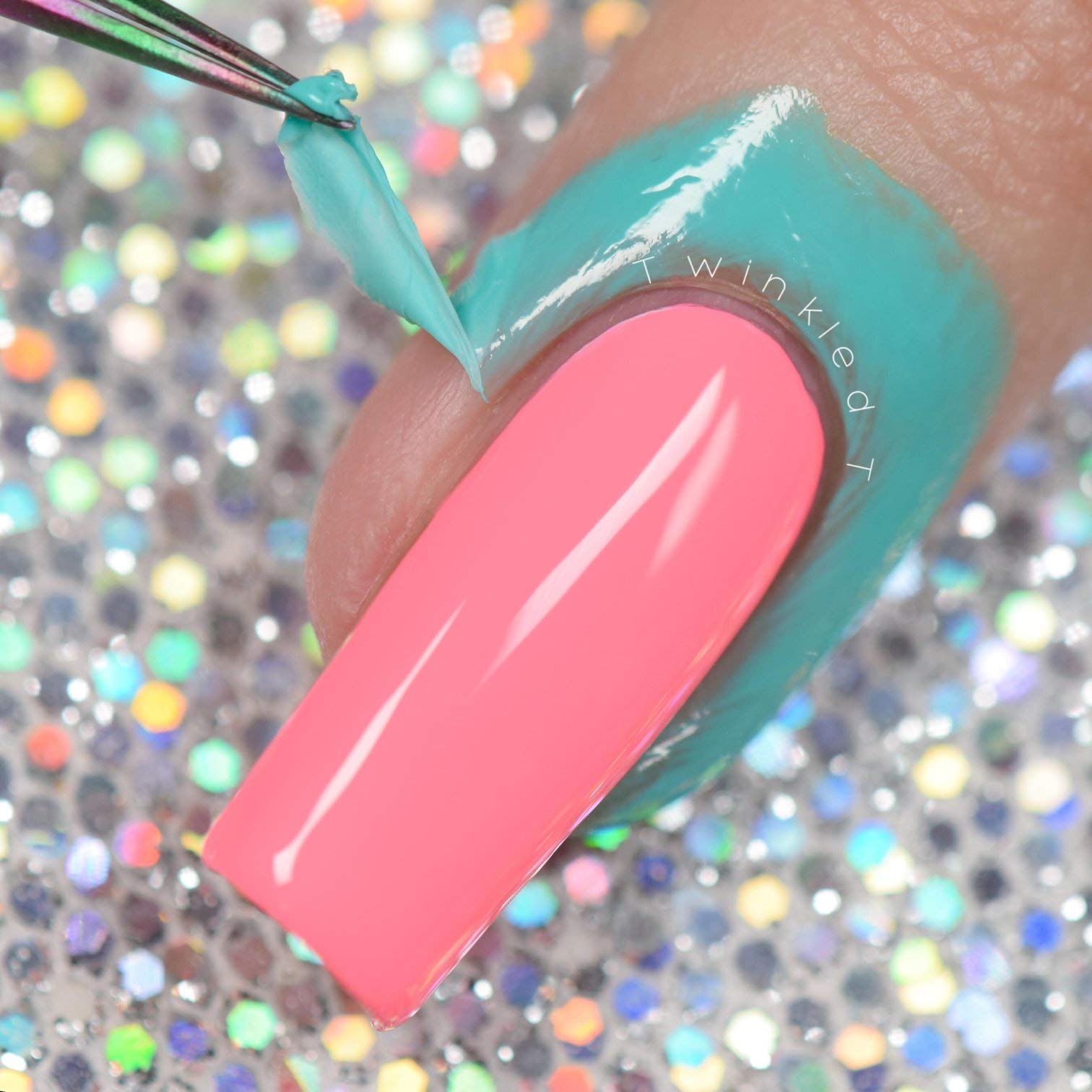 Tweezers pulling away a clean strip of dried Twinkled T liquid latex tape from perfect cuticles