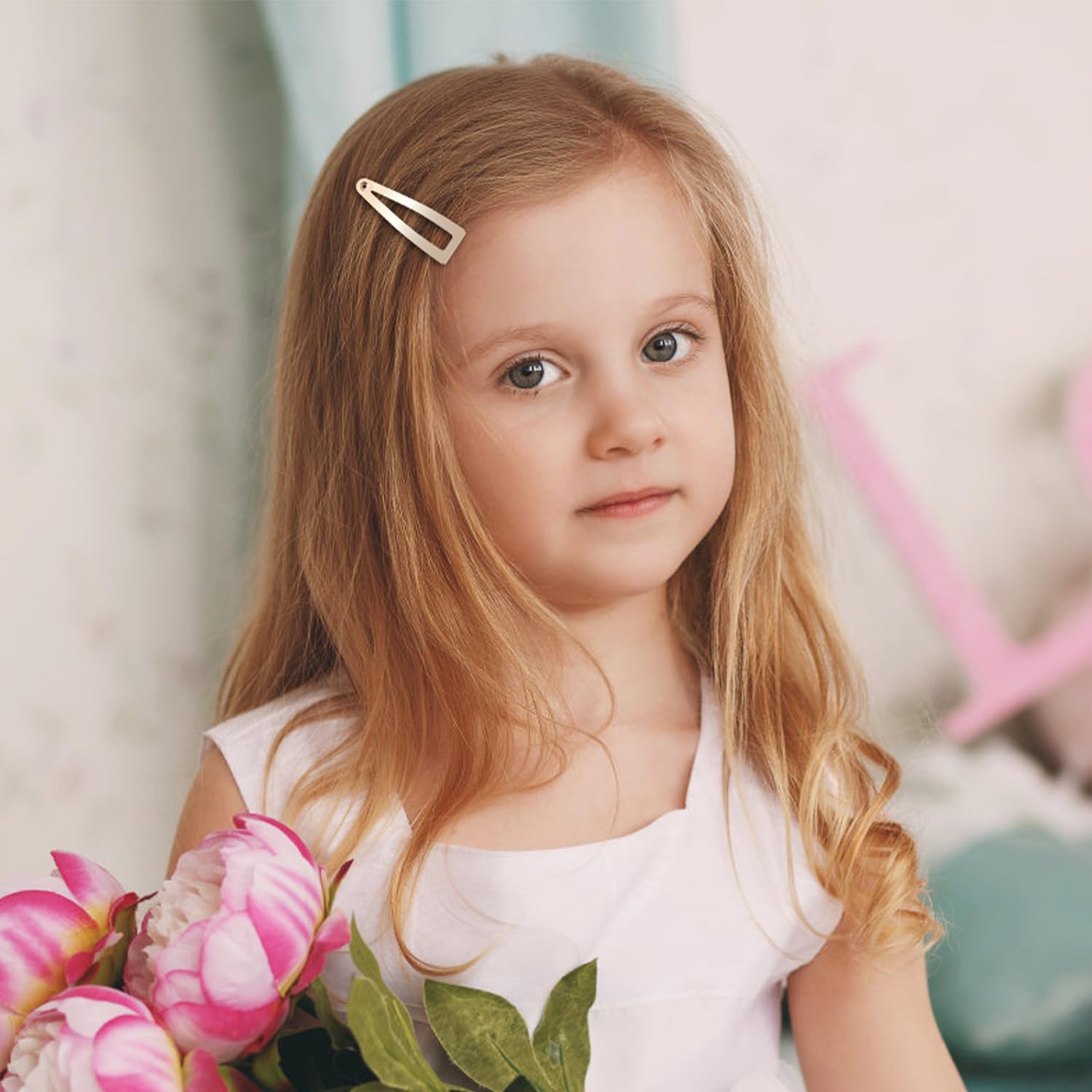 Model demonstrating the secure hold of the black metal hair clip on styled hair